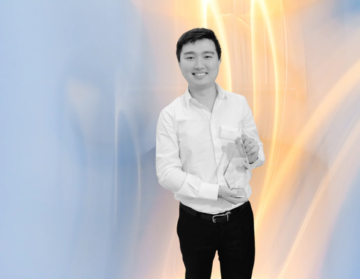 Jay Shen, an asian man with short black hair, and CEO of Transreport, smiling and holding an award. Jay Shen, an asian man with short black hair, and CEO of Transreport, smiling and holding an award.