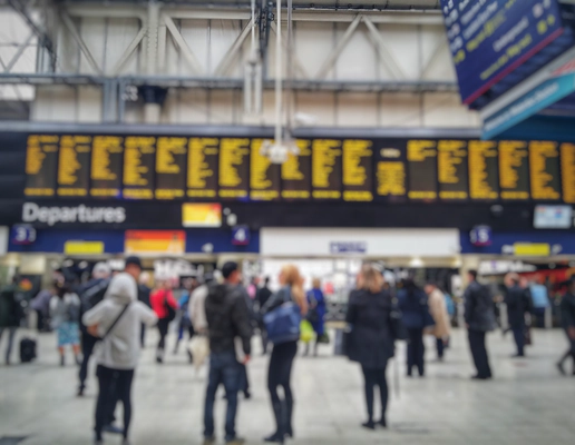Blurred image of crowded passengers in Waterloo looking at the timetable. Blurred image of crowded passengers in Waterloo looking at the timetable.